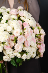 A large bouquet of white and pink roses close-up.
