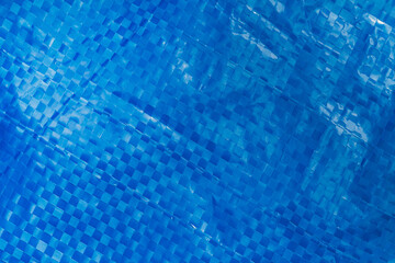 Plastic background of blue plastic material, closeup - 419504558