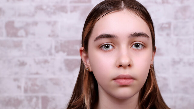 a large portrait of a young girl with large bright eyes, looking piercingly