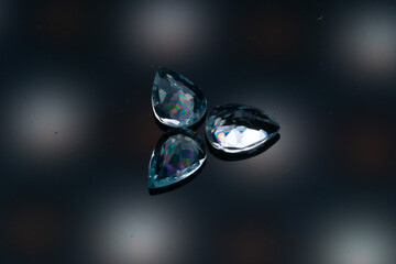 Natural stone blue topaz on a black background