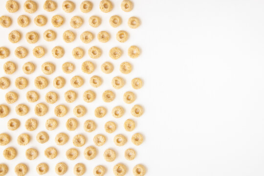 Breakfast cereal isolated on white background. Whole weat circular cereal cheerios.