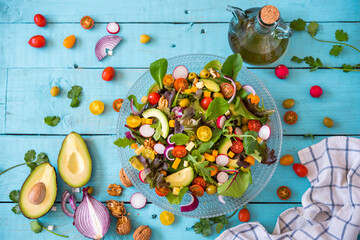 Mediterranean salad. Fresh salad on wooden background