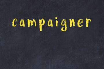 Black chalkboard with inscription campaigner on in