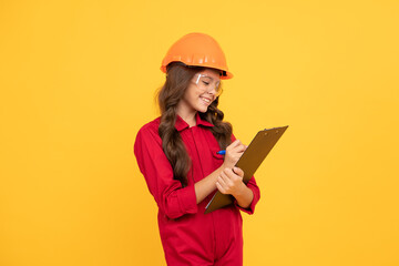 happy teenager girl in protective eyeglasses and helmet hold document folder, making notes