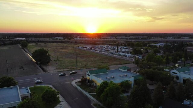 Aerial Slider Shot View of the Sun Setting in Fresno Valley California - Part