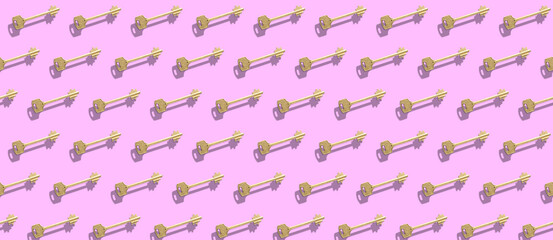 The pattern with golden keys on the pink background