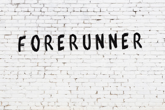 White wall with black paint inscription forerunner on it