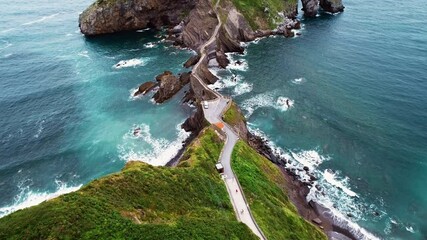 Magnificent aerial opening shot of the Gaztelugatxe islet in Spain.