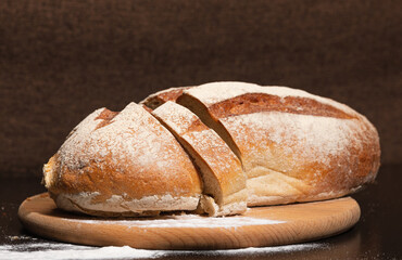 Fresh and tasty bread on a wooden board. Bakery products.