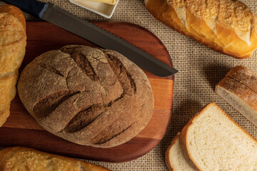 A mix of different types of breads on the table.