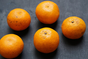 Fresh citrus fruit isolated on black background.