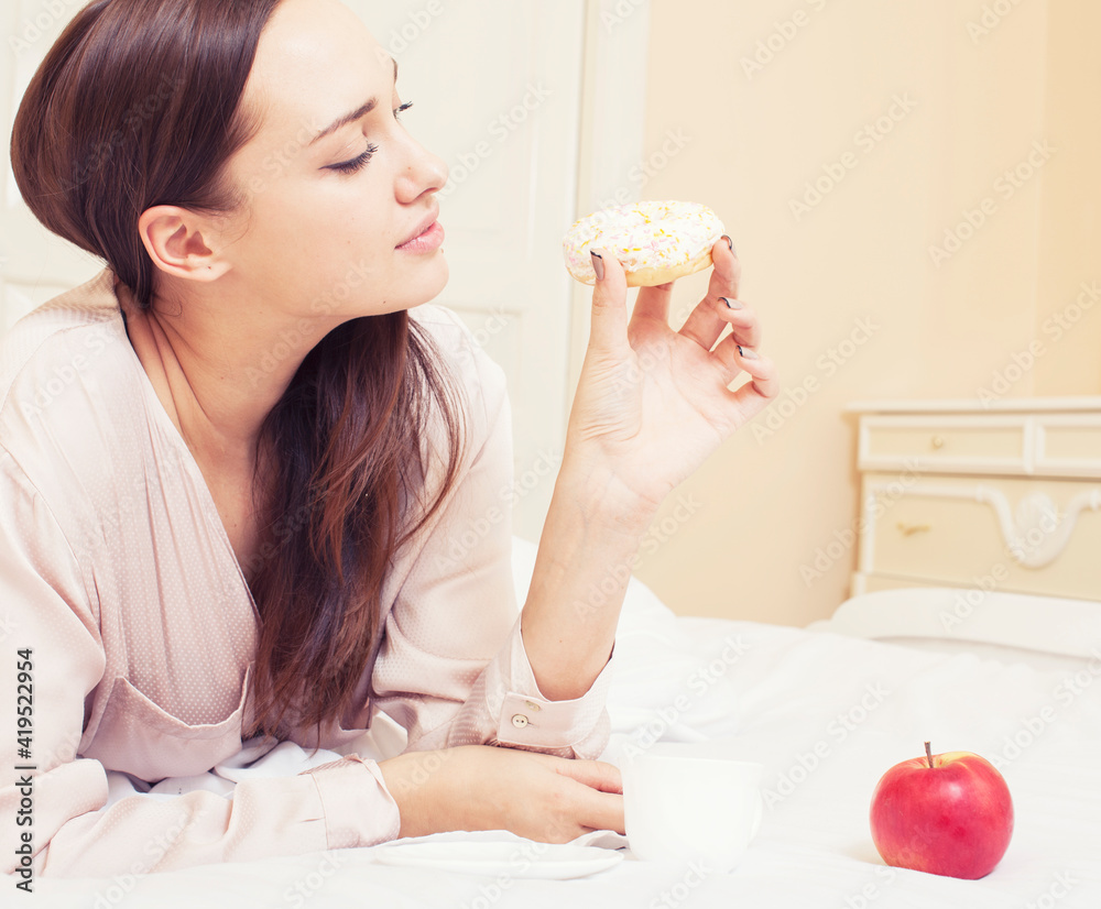 Wall mural young pretty brunette woman laying in bed, luxury white interior vintage having breakfast cute