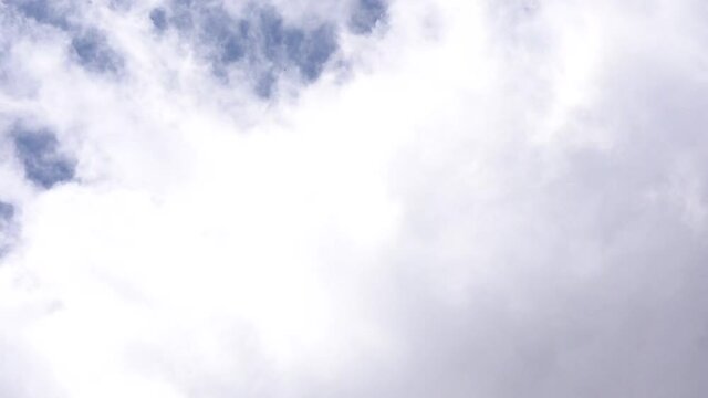 Time-lapse of a storm forming over blue skies