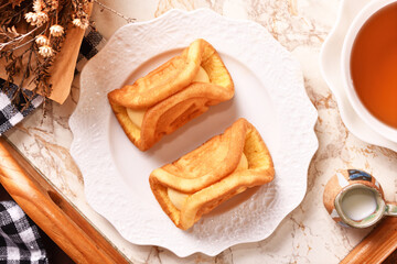 Cream waffles on white plate   