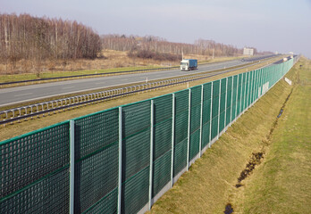 Sound-absorbing barriers separating the highway from the residential area. Also known as absorbing panels, soundbars, noise barriers etc.