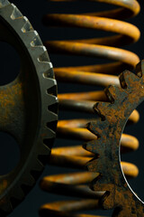 Rusted gears and spring.