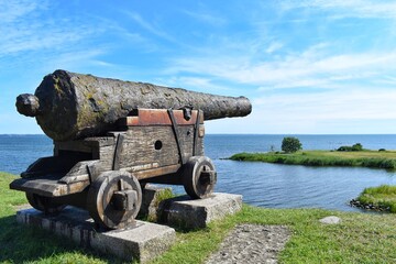View from the wall Kalmar castle, Sweden. Ancient cannon aimed to the sea. © PRANGKUL