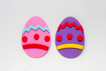 Foam egg in pink and purple color, used for Easter decoration.