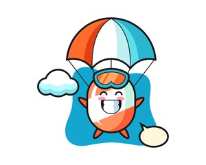 Candy mascot cartoon is skydiving with happy gesture