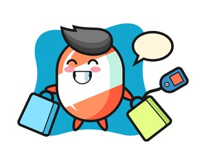 Candy mascot cartoon holding a shopping bag