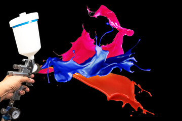 Blurred background paint sprayImage of the painter's arm hand holding industrial size spray gun...