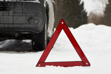 Car with a breakdown on snowy road. Winter driving