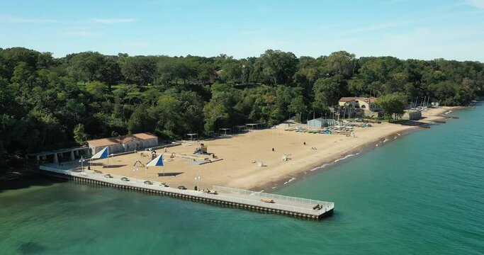 Aerial of a beautiful suburban beach with pier and big sandy area
