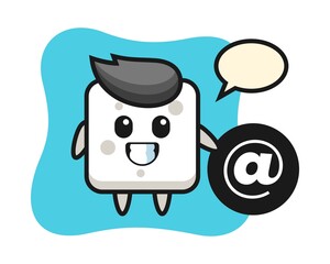 Cartoon illustration of sugar cube standing beside the At symbol