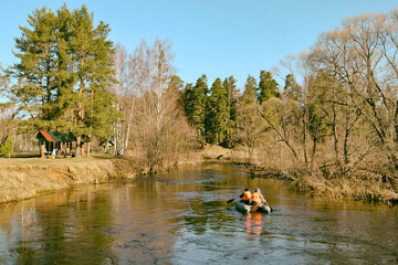 Kayaking on the river in the spring. A kayak with two athletes f