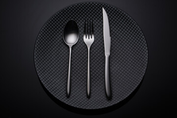 Dining tool on dark plate and background 2