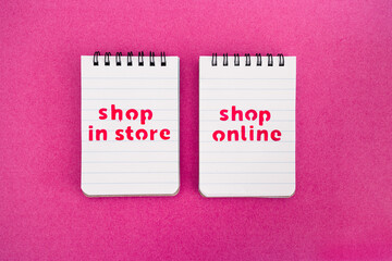 shop in store vs shop online texts on notepads, competition and retail industry