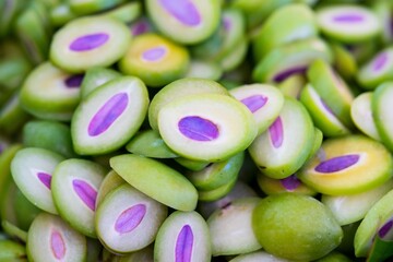Close up of Green Small raw mango sliced, thai street food market