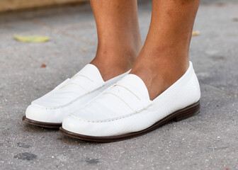 Fototapeta na wymiar White leather loafers shoes women’s fashion