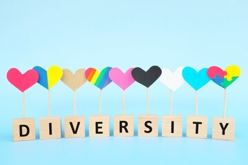 Cultural, racial, gender, age and general equality, inclusion, love and diversity concept. Multicolored heart shape icons in blue background.	