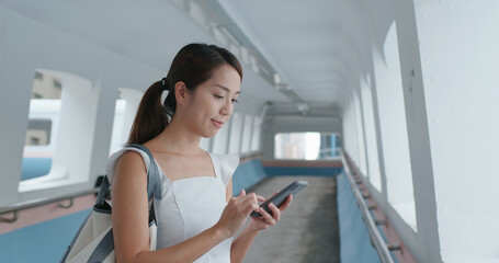 Woman use of smart phone in city