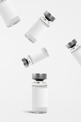 Falling injection vial glass bottles with white labels
