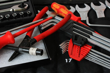 The mechanic's toolbox lies on the workbench