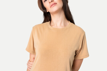 Beautiful woman in basic beige t-shirt with design space
