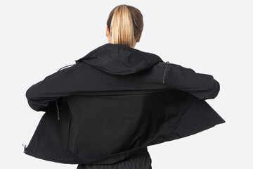 Blonde woman in windbreaker jacket for sportswear fashion photoshoot rear view © Rawpixel.com