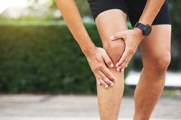 Close up athlete man, Knee pain after exercise .It happens often