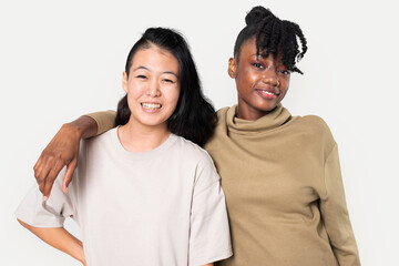 Obraz premium African American and Asian woman in plain t-shirts for apparel shoot