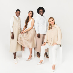 Fototapeta premium Diverse group of people wearing earth tone casual outfit for apparel ad