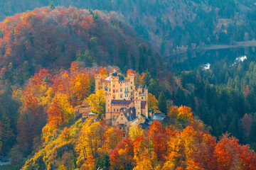 Hohenschwangau castle near famous Neuschwanstein castle in beautiful autumn colors in Bavaria and Fussen province - 419542362