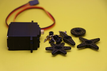 Metal servo used in robotic and DIY projects with different types of horn attachments