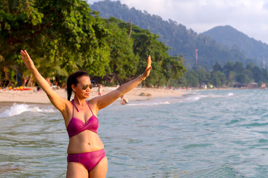 Woman shape beautiful in bikini at beach