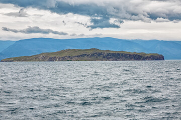 Fototapeta na wymiar Lake Baikal in cloudy weather. Cold summer