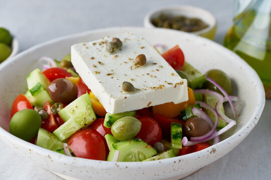 Greek village salad horiatiki with feta cheese and vegetables, vegeterian mediterranean food, low calories keto dieting meal, side view, close up