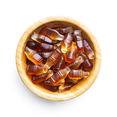 Jelly candies with cola flavor in bowl.