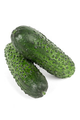 three green fresh cucumbers isolated on white background.