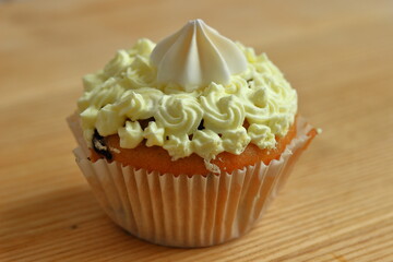 Sweet cream cupcake for dessert.